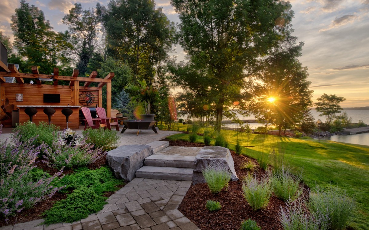 Backyard landscape and kitchen at sunset.